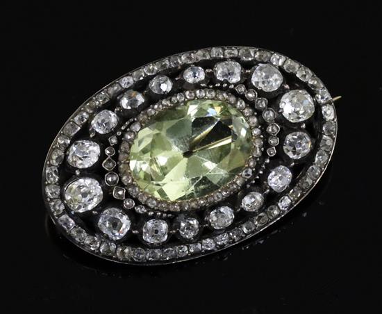 A Victorian gold and silver, pale green beryl and diamond set oval brooch, 36mm.